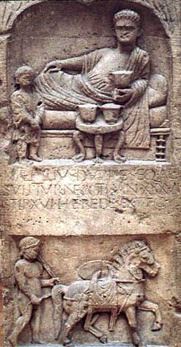 Depiction of feasting was a common motif in Roman funerary art. The diner is represented reclining on a couch, with other furniture and dining gear. This is the tombstone of auxiliary cavalryman M. Aemilius Durises from Bonn, Germany