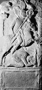 The tombstone of Flavinus, standard bearer 
                    of the cavalry unit the ala Petriana. The depiction 
                    of the cavalryman riding down a barbarian was a favoured tombstone 
                    relief for Roman auxiliary cavalry troopers