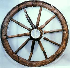 A wooden wagon wheel from Newstead, southern Scotland. The wheel, c. 0.9m in diameter from a waterlogged deposit of the first century AD, has a hub of elm protected by an iron ring, spokes of willow  and an ash rim.