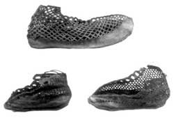 Some examples of more elaborate footwear from Vindolanda, with the leather of the uppers cut away to produce a type of 'fishnet' effect. Despite their flimsy appearance, such boots were hard wearing. They were worn by men and women.