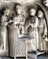 Toilette scene  from a funerary monument found at Neumagen, near Trier, Germany. A lady views her reflection in the mirror while 4 servants arrange her hair and bring water
